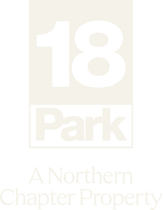 A green and white sign that says 18 Park.