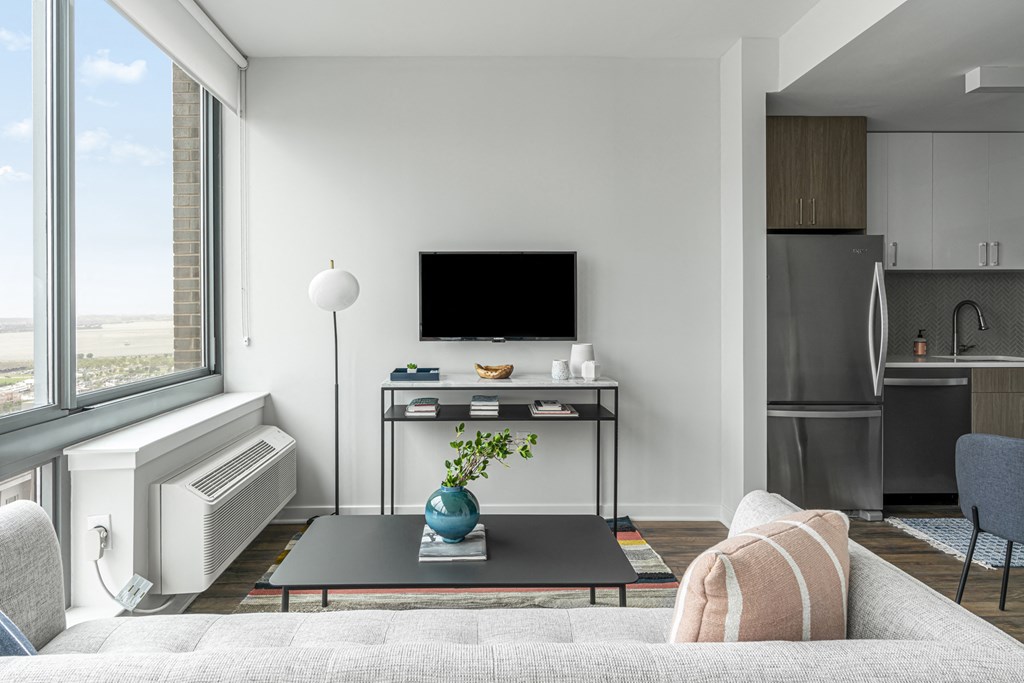 a living room with a couch and a table and a television