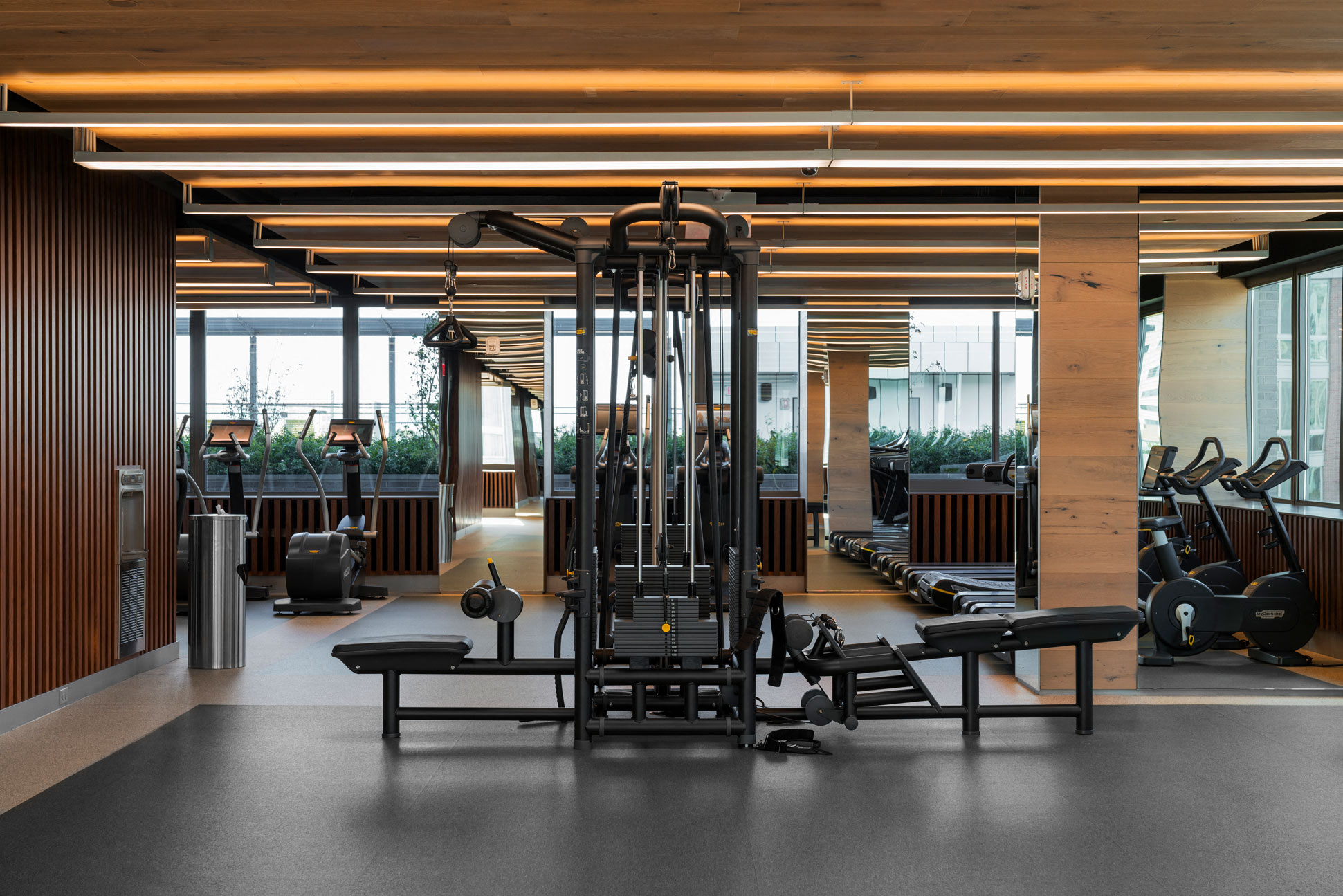 a gym with weights and other exercise equipment on the floor