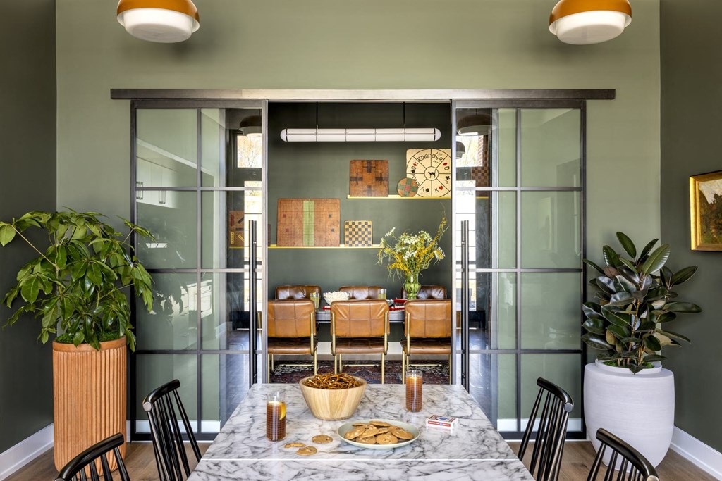 a dining room with a table and chairs