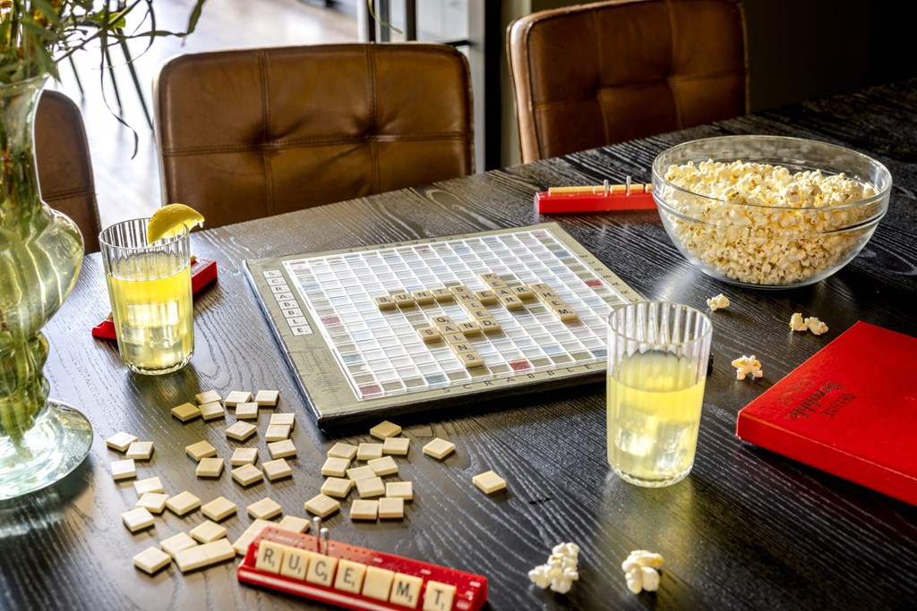 a table with a board game and a bowl of popcorn on it