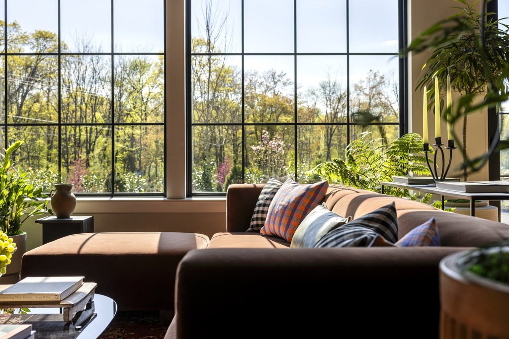 a living room with a couch and a large window