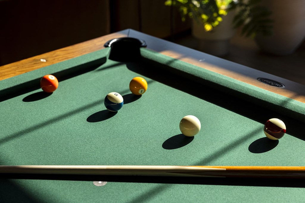 a pool table with billiard balls on it