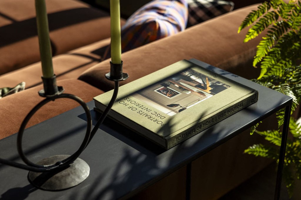 a book sitting on top of a table with candles