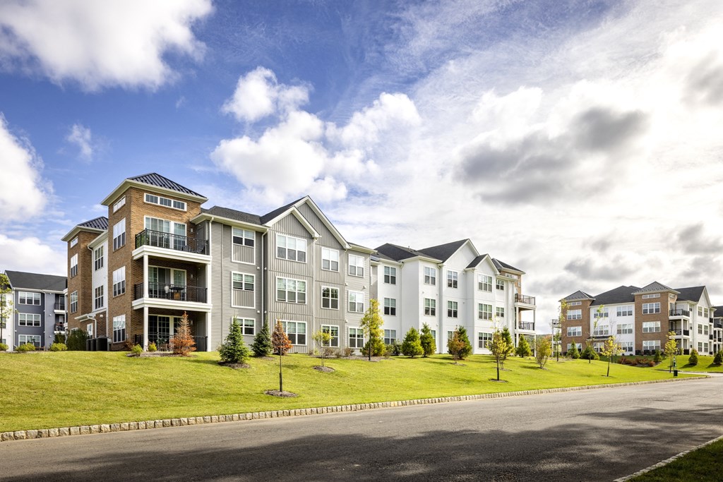 A large apartment complex with multiple buildings and balconies.