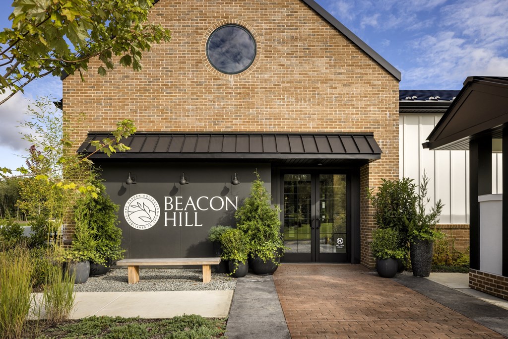 The front of a building with a sign that says Beacon Hill.