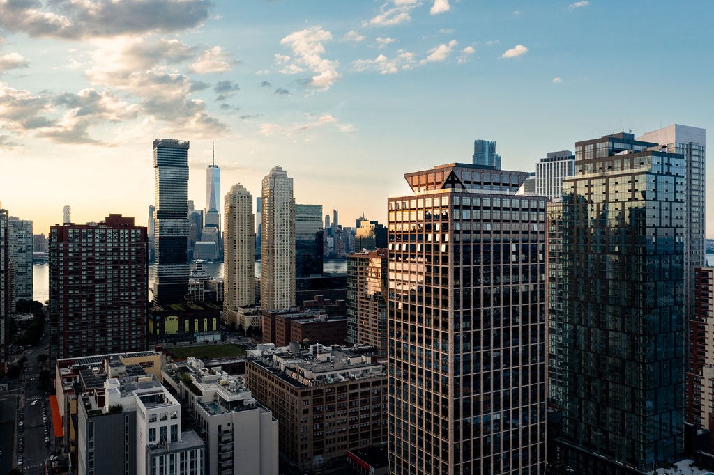a view of the city skyline from the top of a skyscraper