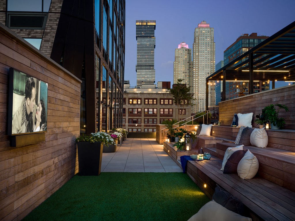a terrace with a view of the city at night