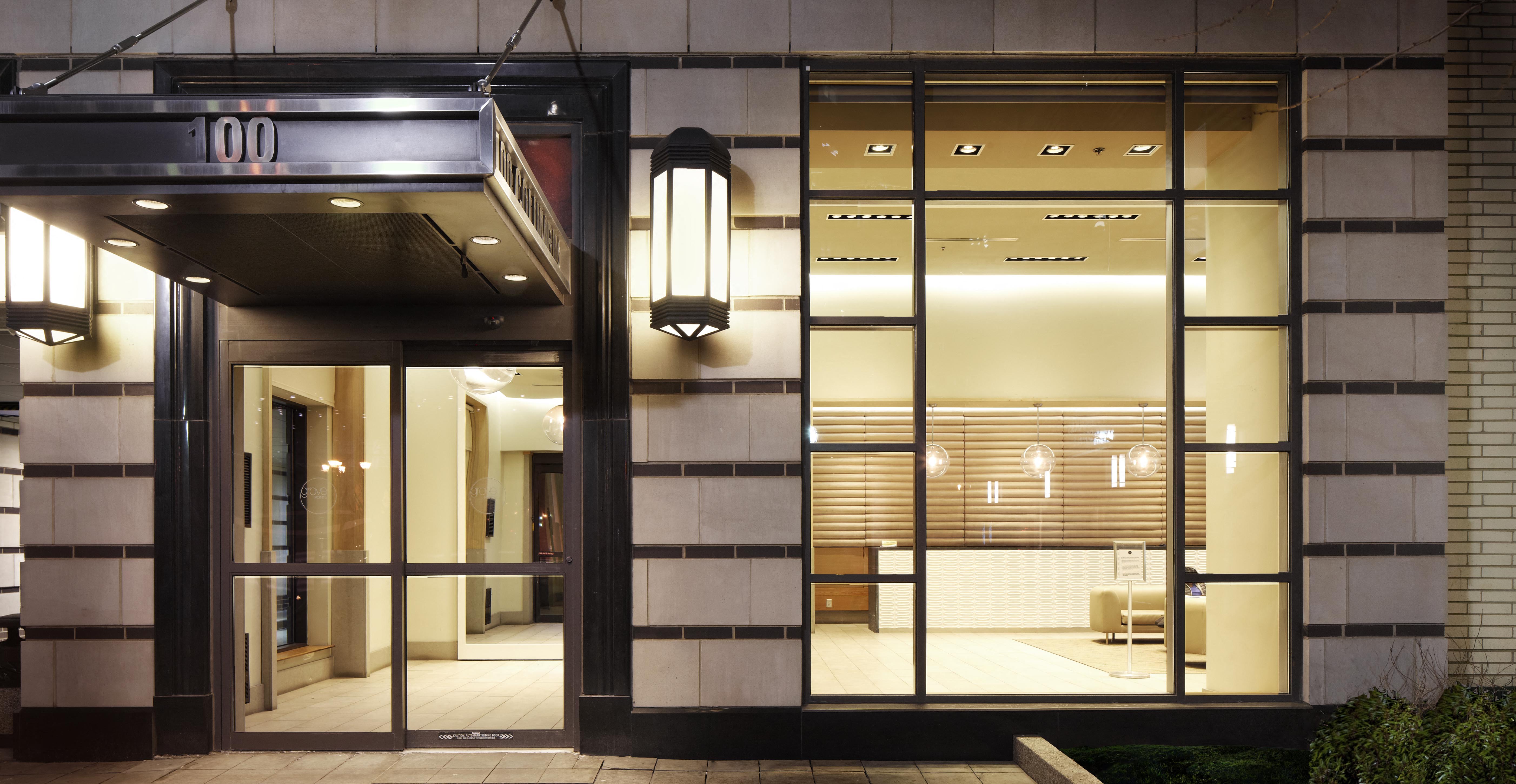 the facade of a building with large glass windows