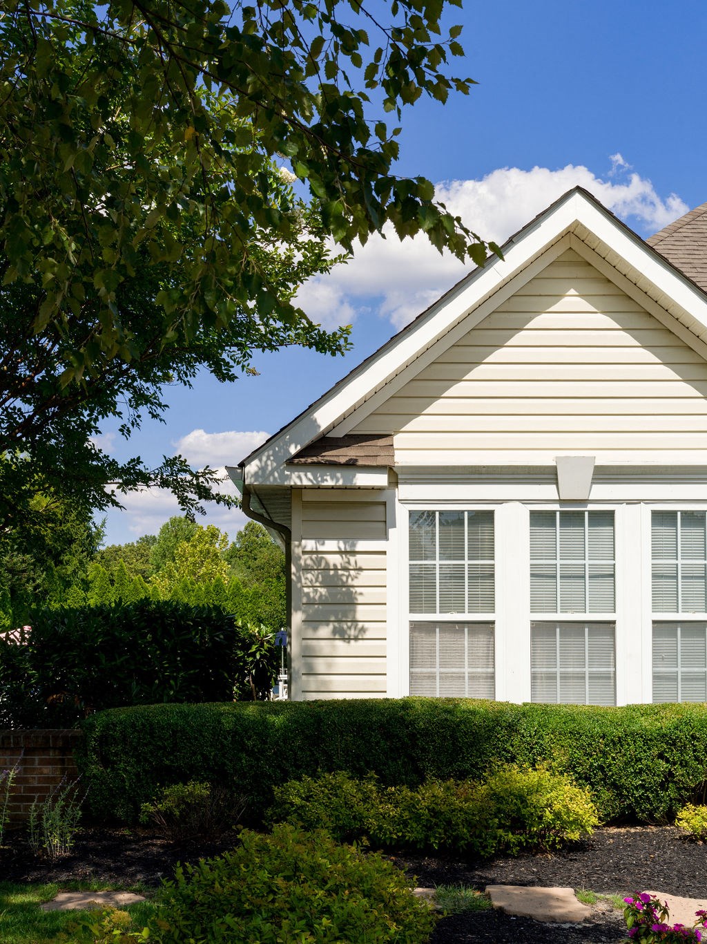 a white house with white shuttered windows