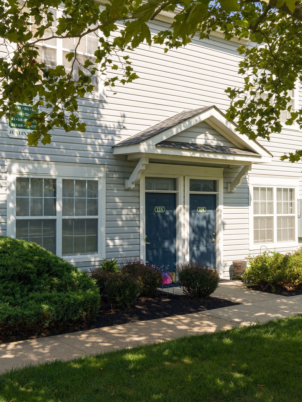 the front of a house with a blue door