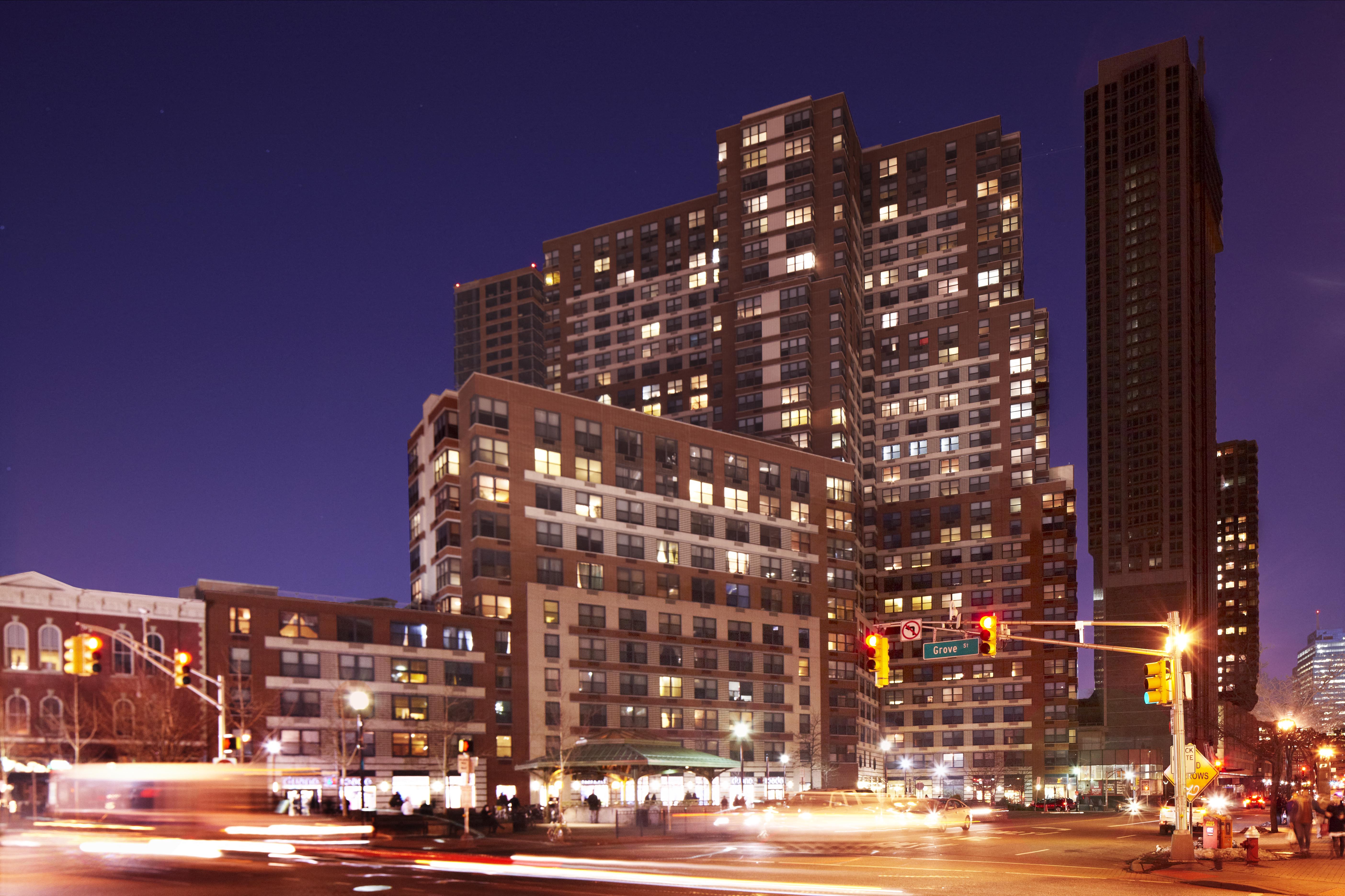 a city at night with traffic and tall buildings