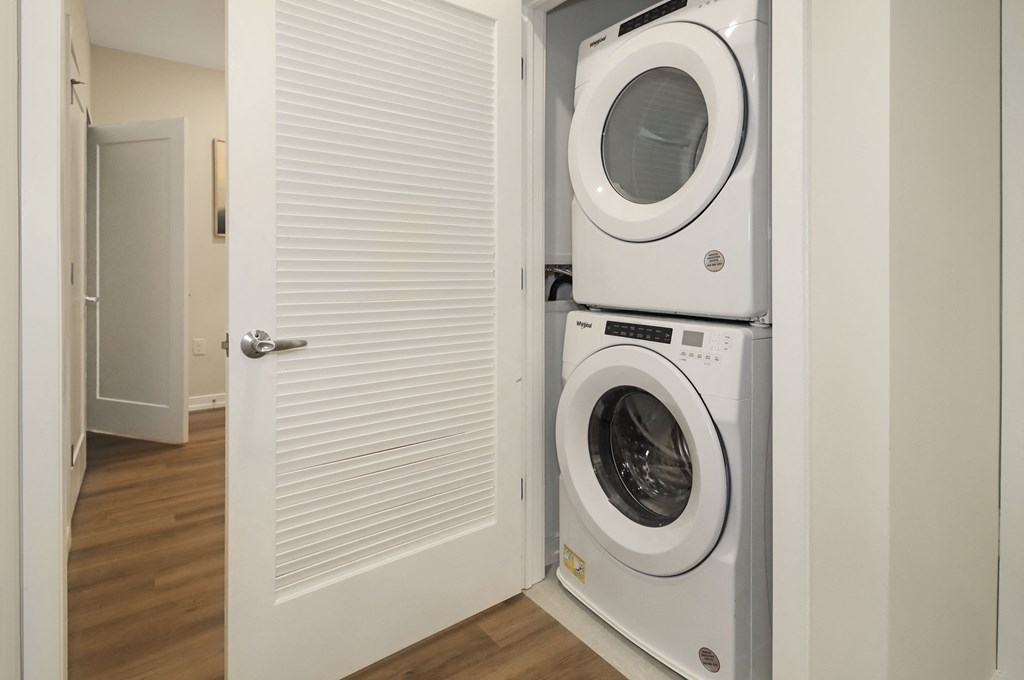a front loading washer and dryer in a laundry room