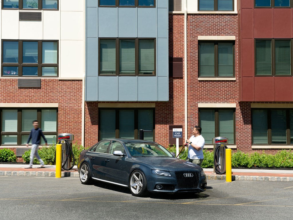 a black car parked at a parking meter