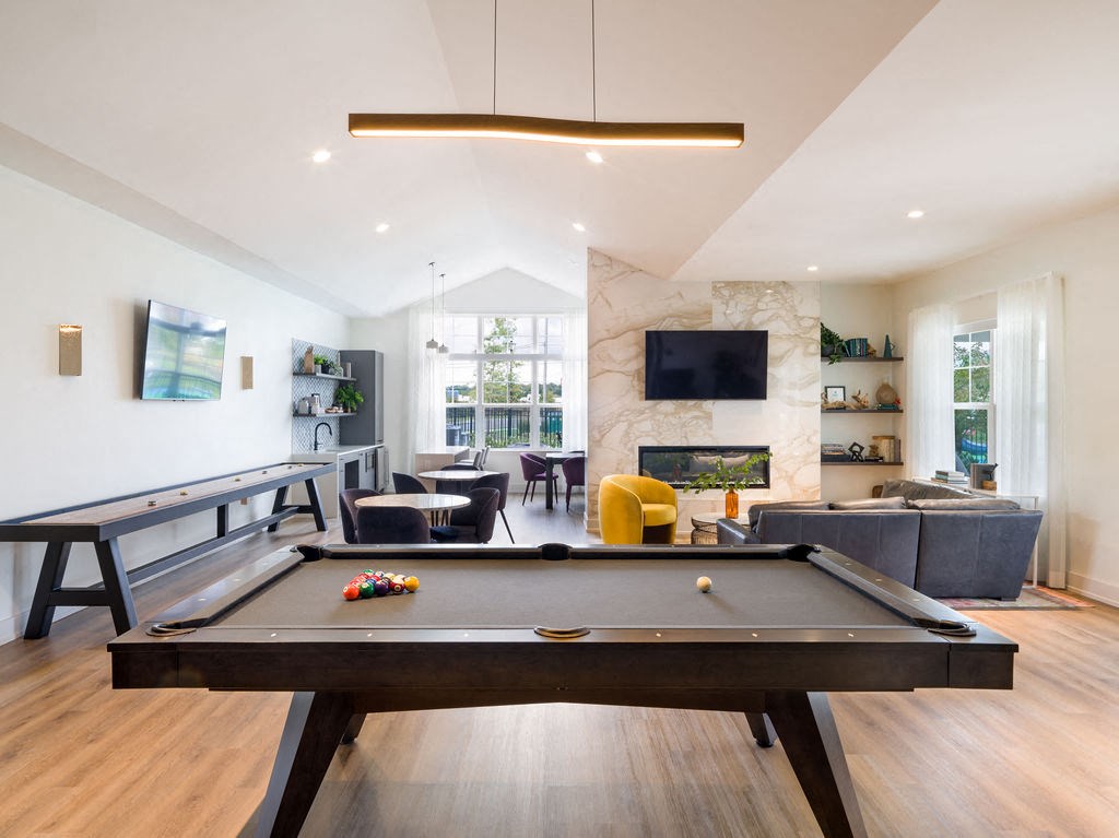 a pool table in the center of a living room