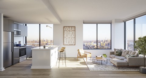 an open living room and kitchen with a view of the city