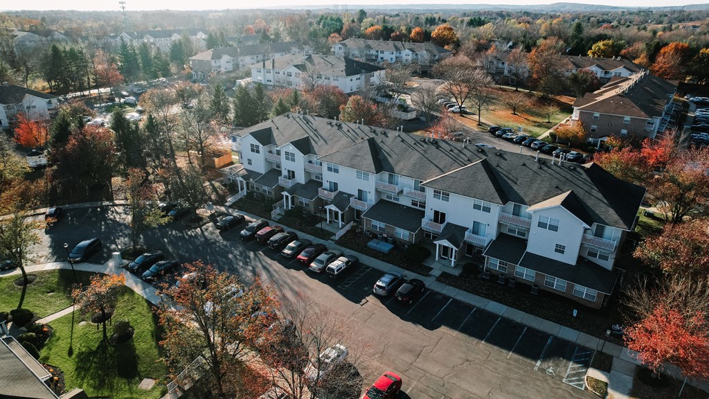 a aerial view of a neighborhood with houses and cars