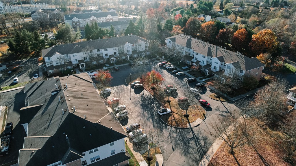 an aerial view of a neighborhood with houses and cars