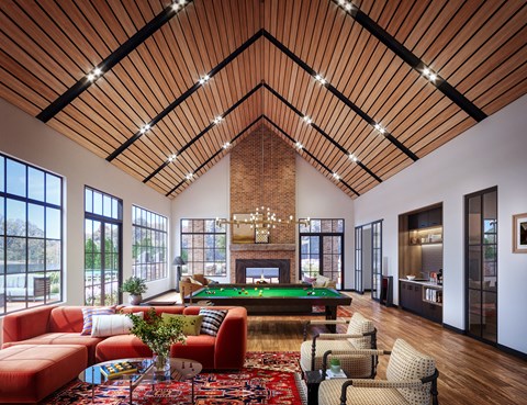 a living room with a fireplace and a pool table