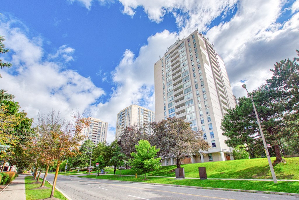 a city street with tall buildings on the side of it