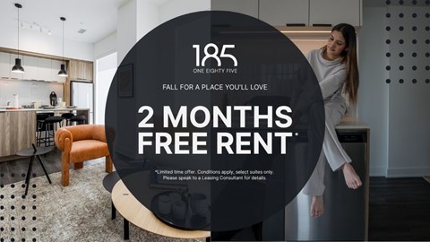 A woman is standing in a modern kitchen with a 2 months free rent offer.