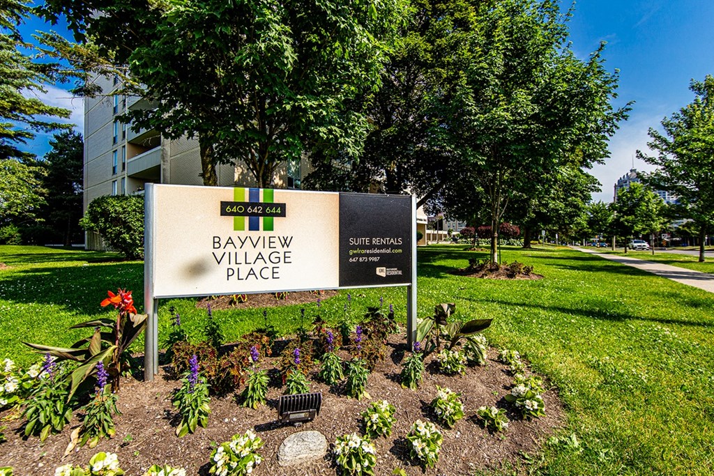a sign in front of a park
