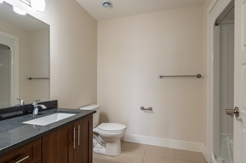 an empty bathroom with a toilet and a sink