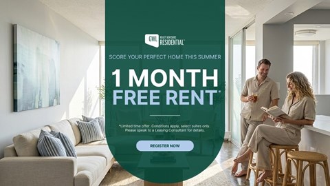 A man and woman are sitting in a living room, with a sign offering a free one-month rent.