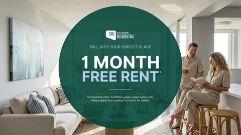 A man and woman are sitting in a living room, with a large circular graphic in the foreground advertising a 1 month free rent offer.