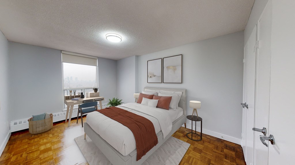 a bedroom with a bed and a desk with a window