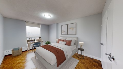 a bedroom with a bed and a desk with a window