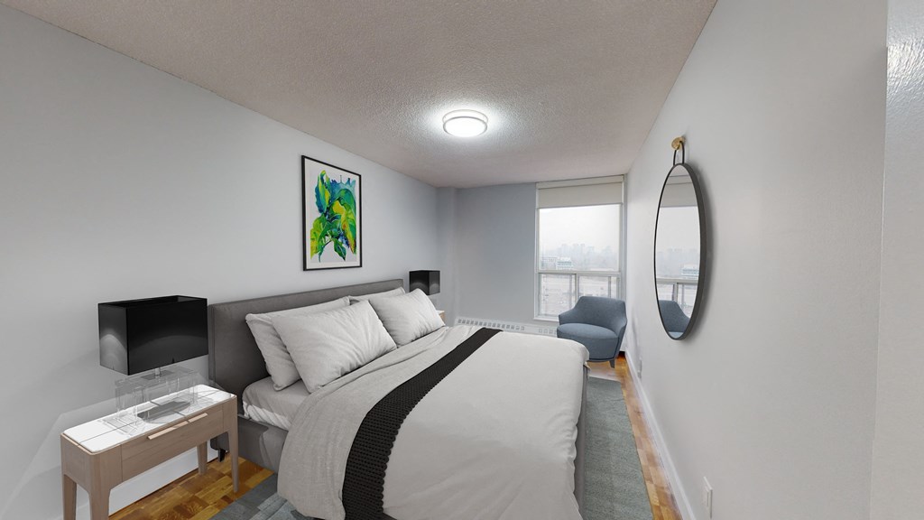 a bedroom with a large bed and a window