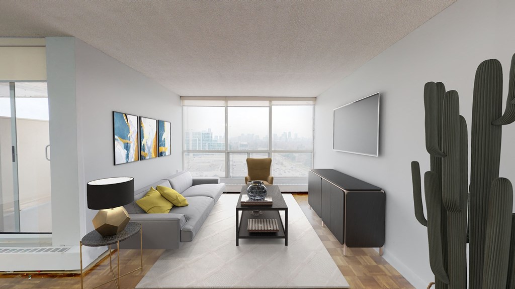 a living room with a couch and a coffee table and a cactus