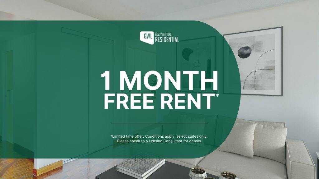 A room with a couch and a coffee table is shown with a sign offering 1 month free rent.