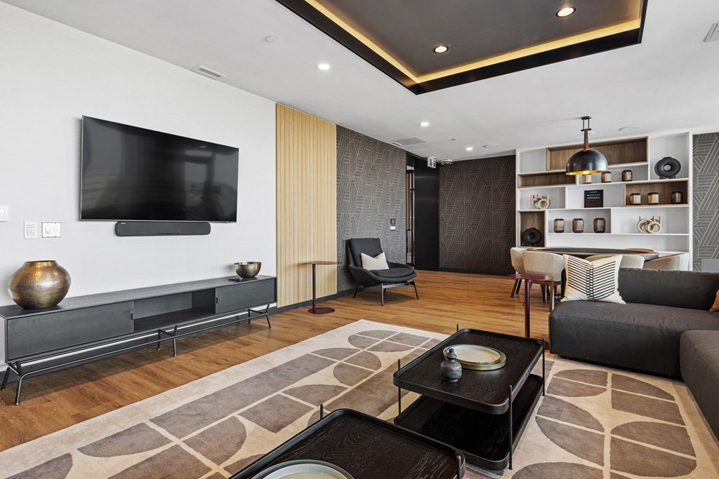 a living room with a tv and a table