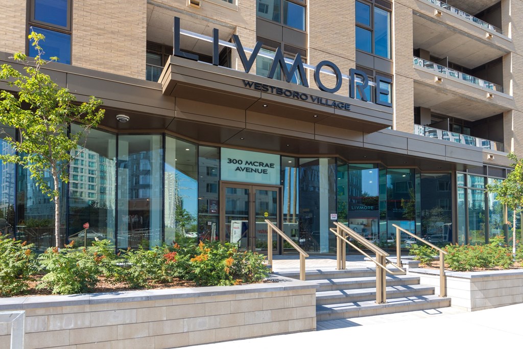 the front of a building with stairs in front of it