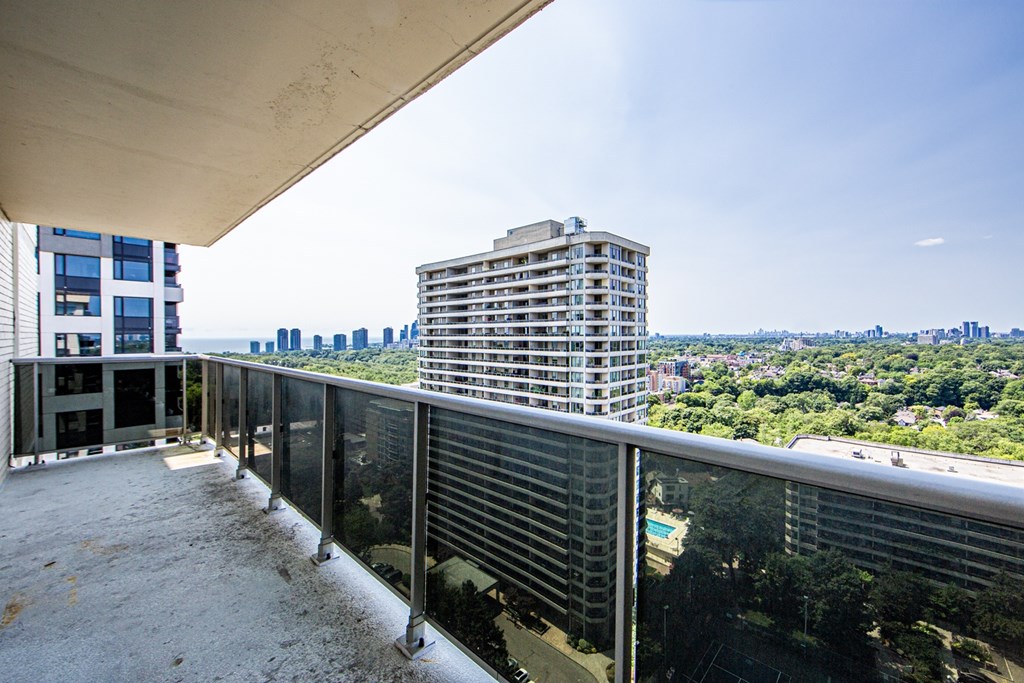 A balcony with a view of a cityscape.