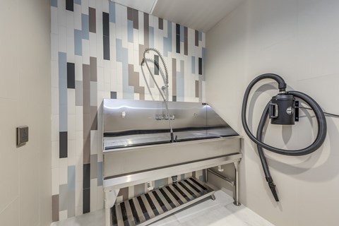 A modern bathroom with a shower and a bench.