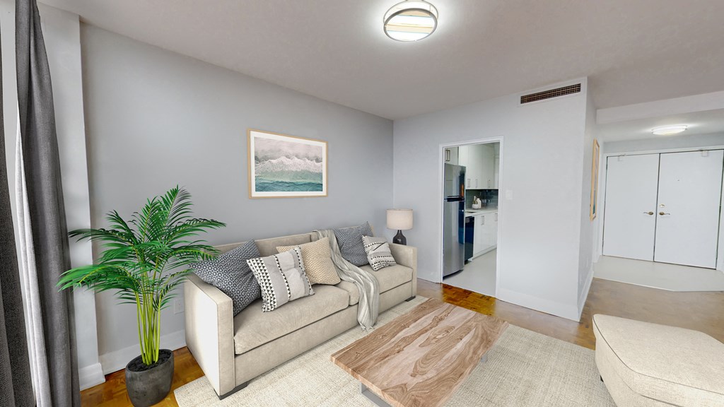 Living room with sofa, chairs, and a coffee table