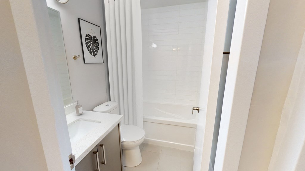 Entrance to bathroom, with toilet and bath