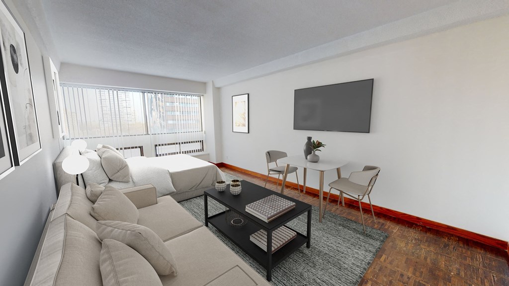 a living room with a couch and a table and a tv