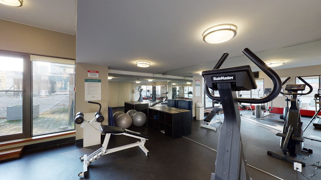 Modern fitness room with various workout equipment