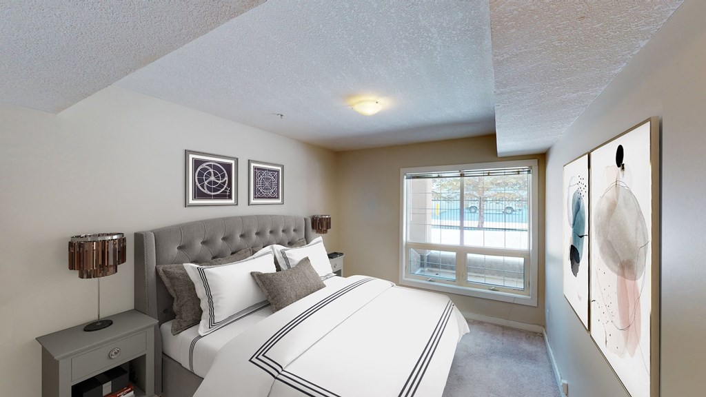 Bedroom with large bed and window