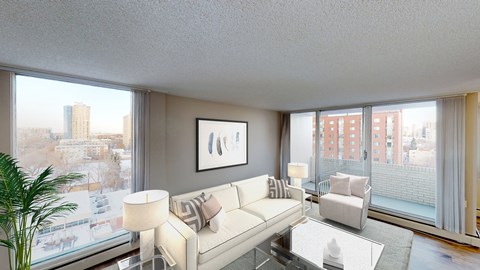 a living room with a white couch and a large window