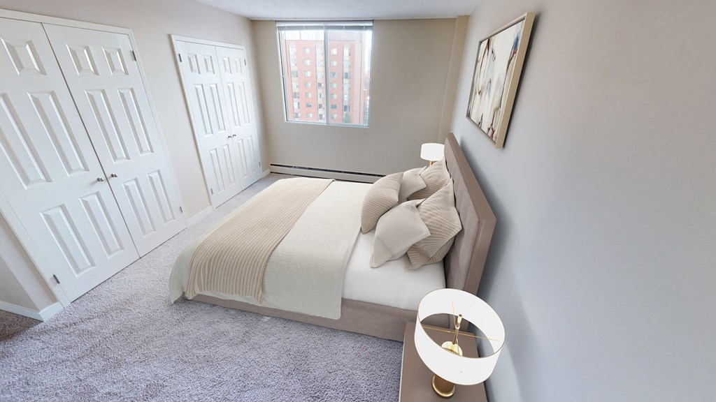 Bedroom with large bed and window