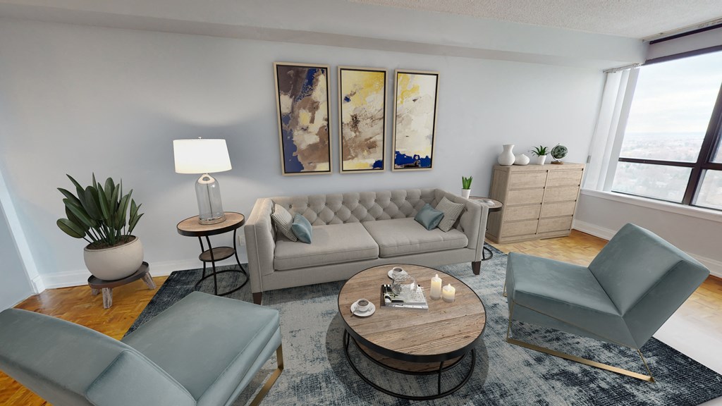 Living room with sofa, chairs, and a coffee table