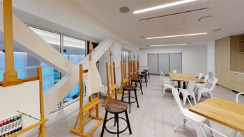 A room with a staircase and a table.