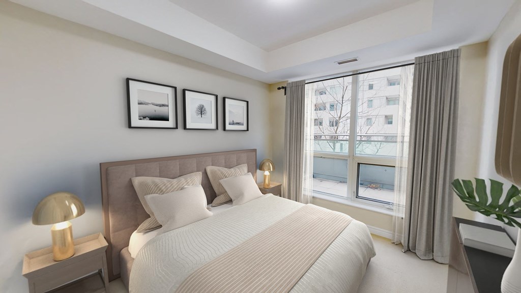 a bedroom with a large bed and a window