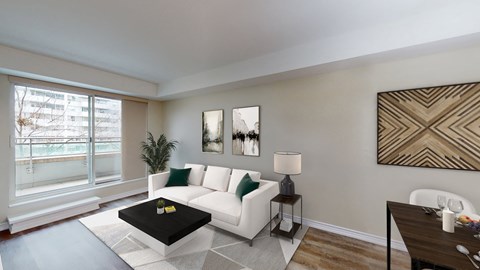a living room with a white couch and a coffee table