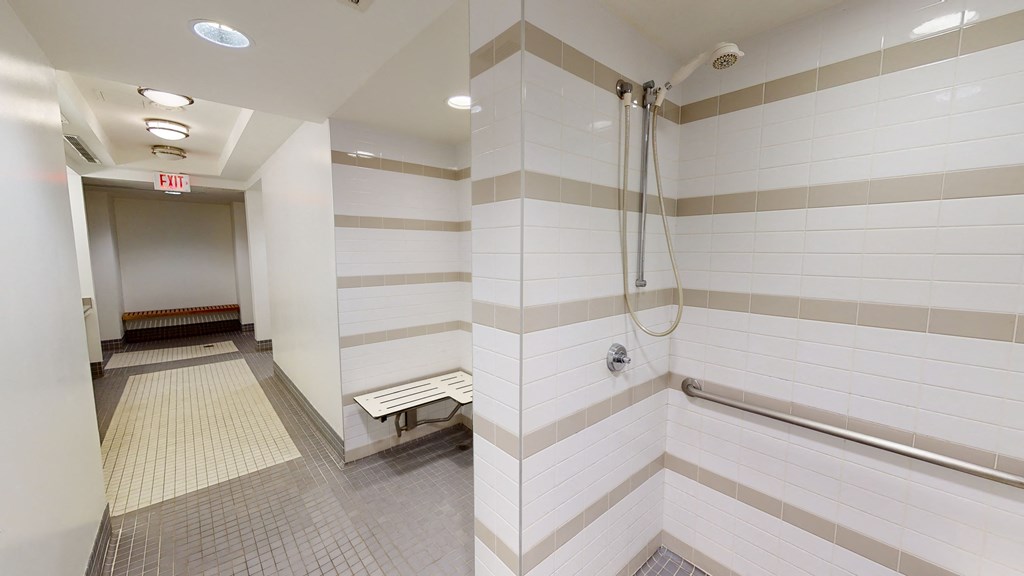 a large shower in a large bathroom in a building